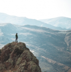Lonely hiker on the top of the mountain